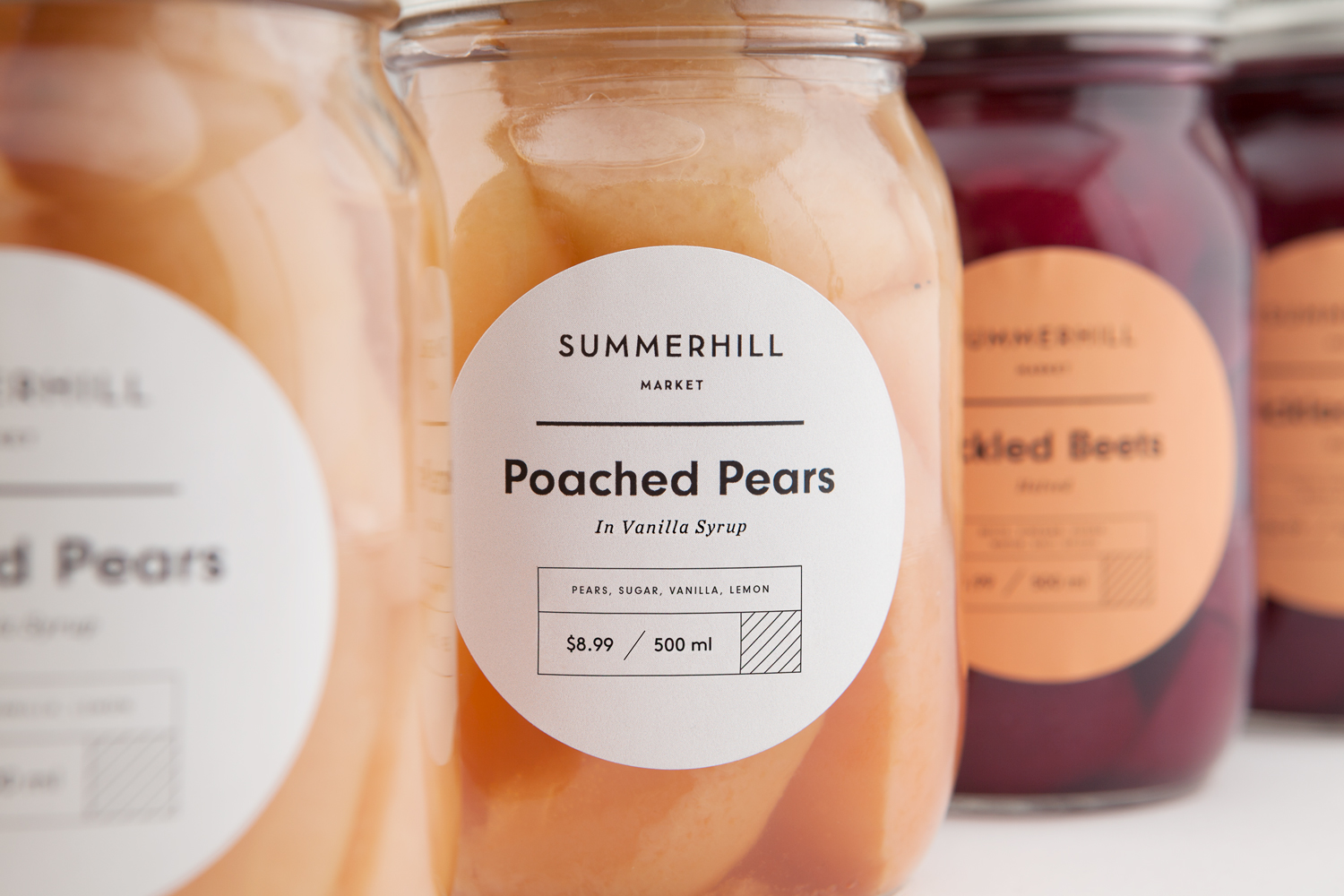Branding and pear packaging designed by Canadian studio Blok for Toronto based boutique grocery store Summerhill Market