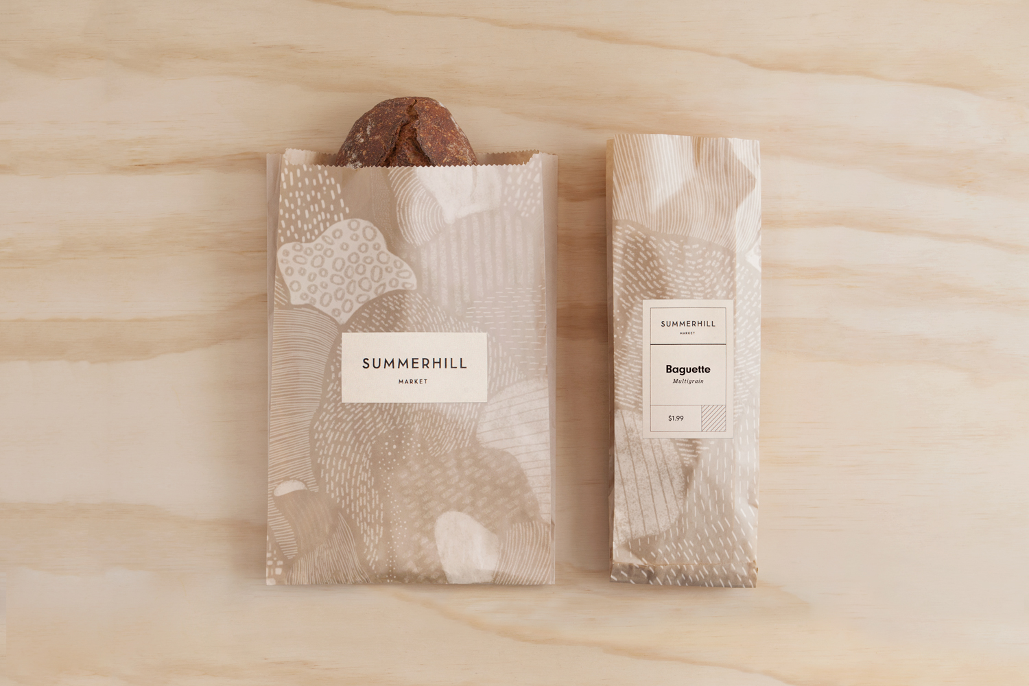 Branding and illustrated bread bags designed by Canadian studio Blok for Toronto based boutique grocery store Summerhill Market