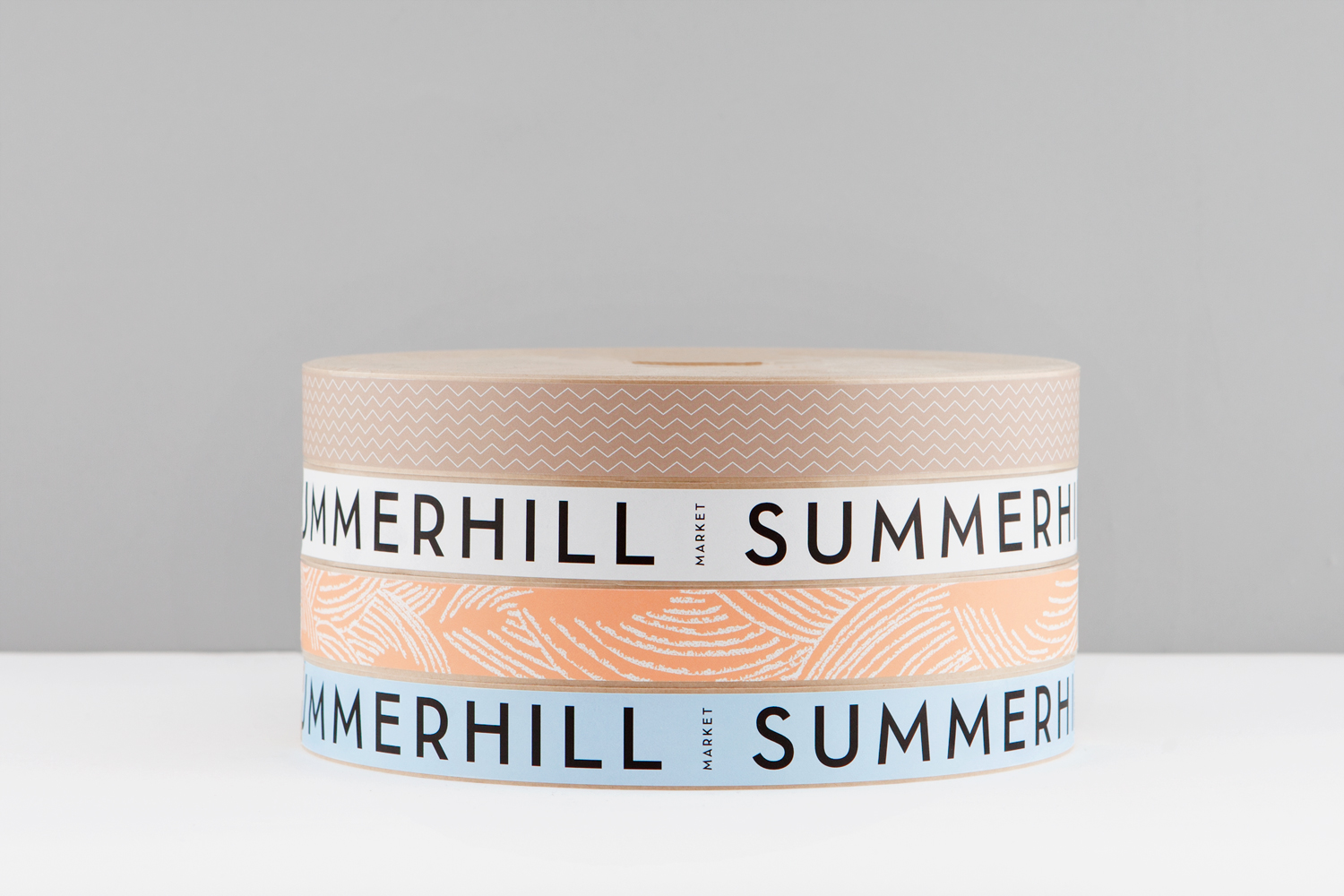 Branded adhesive tape designed by Canadian studio Blok for Toronto based boutique grocery store Summerhill Market