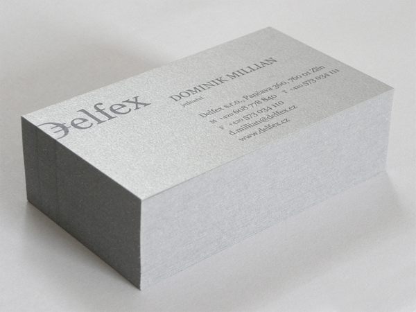 Logo and silver metallic business card designed by Jan Zabransky for currency trading and consulting business Delfex