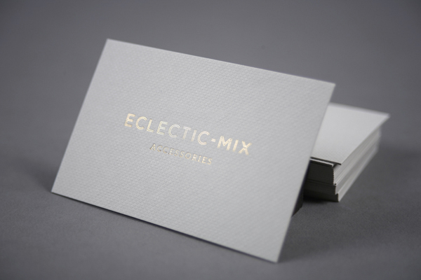 Business card with embossed surface and gold foil detail by Because Studio for fashion accessory label Eclectic-Mix