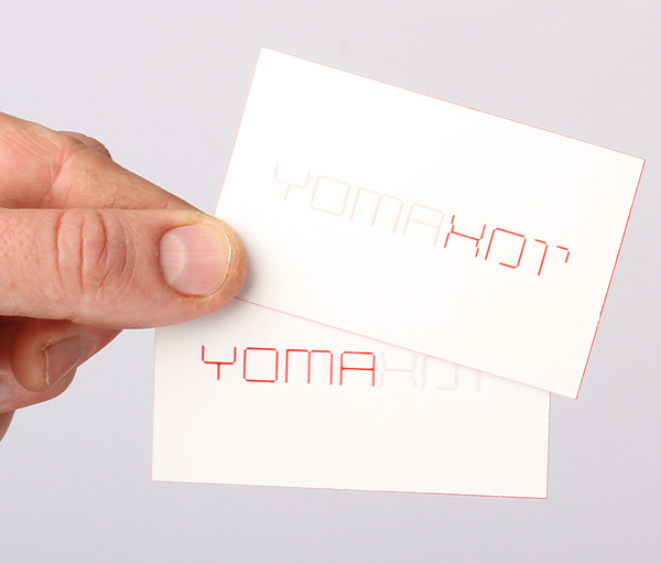 Logo and debossed business card with red edge painted detail designed by Kobi Benezri for Jerusalem-based architecture practice Yoma