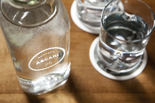 Logo as a glass bottle detail designed by Blok for Toronto based Italian restaurant Ascari Enoteca