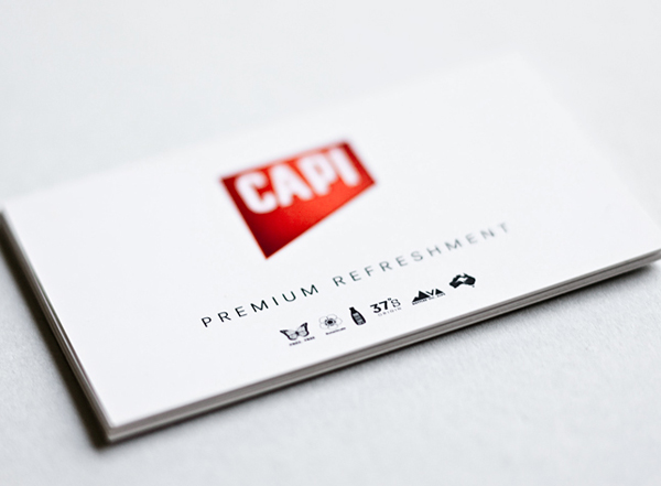 Logo and business card created by CIP for premium carbonated fruit juice, mixer and mineral water brand CAPI.
