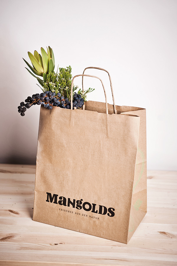 Paper shopping bag with logotype detail designed by Moodley for Austrian vegetarian and wholefood restaurant Mangolds