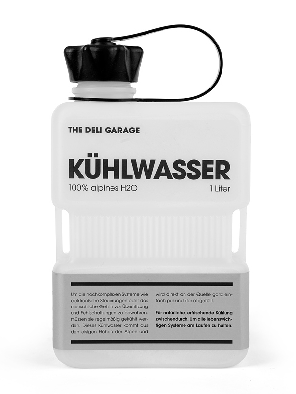 Packaging with screen print and silver label detail designed by Rocket & Wink for The Deli Garage's premium glacial water product Kühlwasser