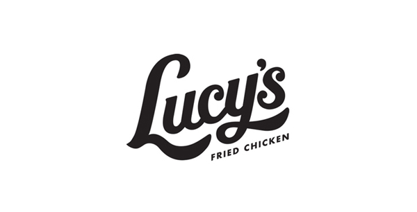 Script logotype designed by Pentagram for Austin based fried chicken and oyster bar/restaurant Lucy's