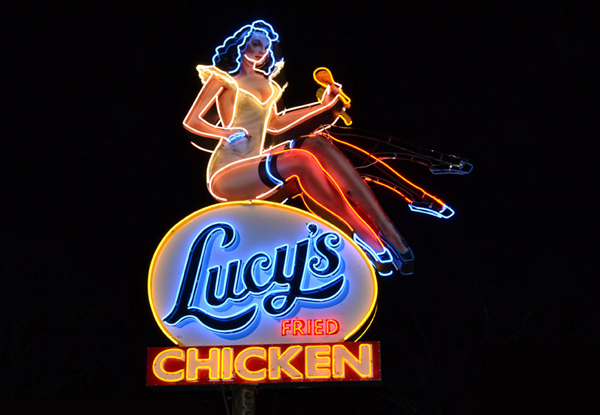 Exterior neon signage designed by Pentagram for Austin based fried chicken and oyster bar/restaurant Lucy's