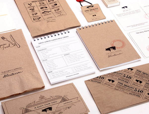 Packaging with uncoated unbleached board and hand stamps created by Glasfurd & Walker for delicatessen The Dirty Apron