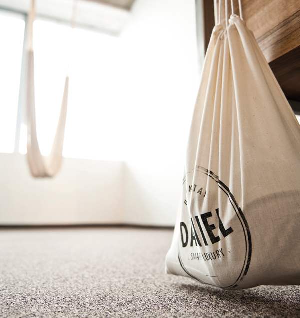 Draw string bag with screen printed logo detail designed by Moodley for Vienna and Graz based luxury hotel Daniel