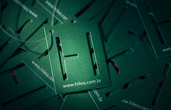 Logo and die cut tag design for social and environmental art project developer Hilea created by Hyperlocaldesign