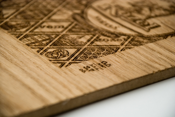 Heat treated wood panel with regional illustrations designed by Yurko Gutsulyak for Czech brewer Velkopopovický Kozel