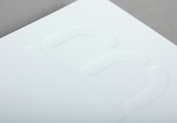 Business card with blind emboss detail for dairy hub Blanca designed by Lo Siento Business card with blind emboss detail for dairy hub Blanca designed by Lo Siento
