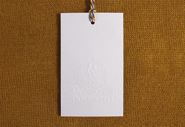 Blind embossed clothing tag for London and Paris-based male fashion brand Smith-Wykes designed by Studio Small