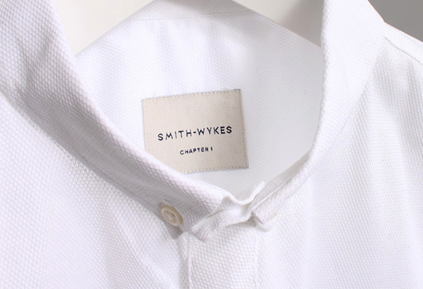 Stitched logo and clothing label for London and Paris-based male fashion brand Smith-Wykes designed by Studio Small