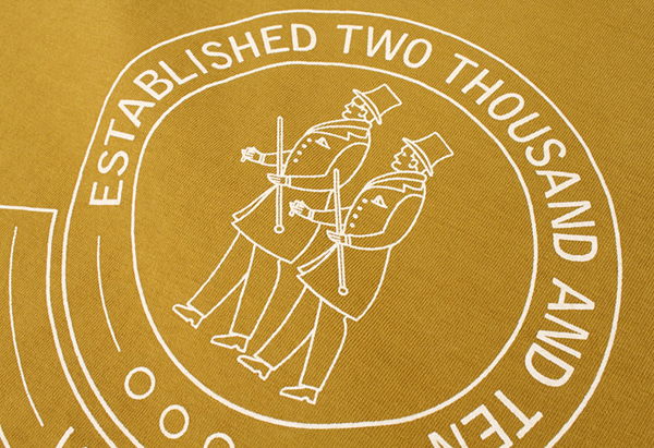 Logo and screen printed mustard T-shirt for London and Paris-based male fashion brand Smith-Wykes designed by Studio Small