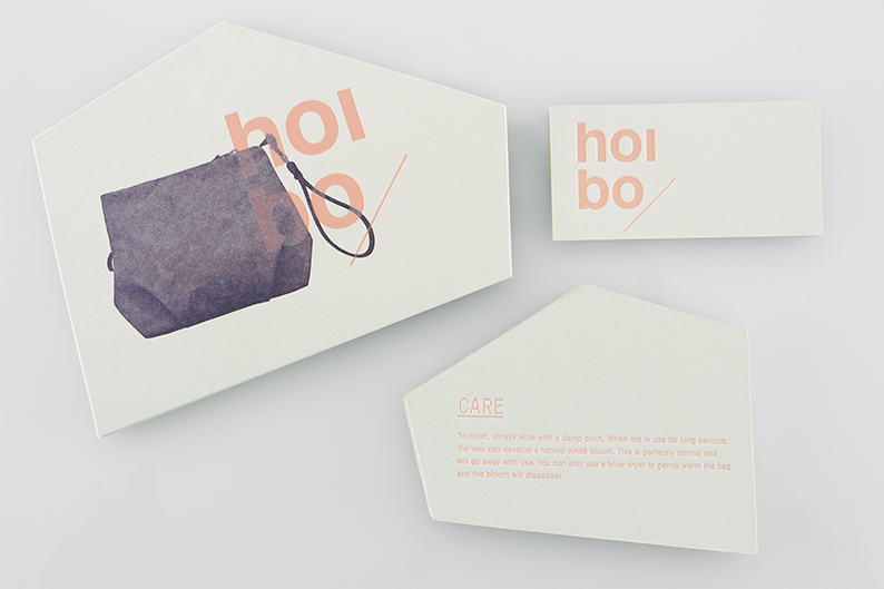 Logo and print with angular die cut detail designed by Blok for luxury bag, clothing and accessories brand Hoi Bo