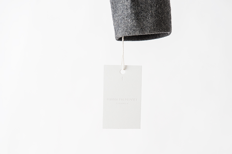 Logotype, mark and blind debossed tag designed by Bedow for fashion designer and label Minna Palmqvist