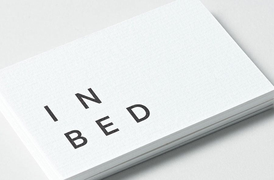 Logo and business card with laid paper detail for linen online retailer In Bed designed by Moffitt.Moffitt