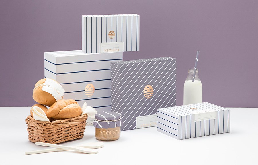 Logo and packaging with copper foil detail designed by Anagrama for traditional Argentinian bakery Voleta