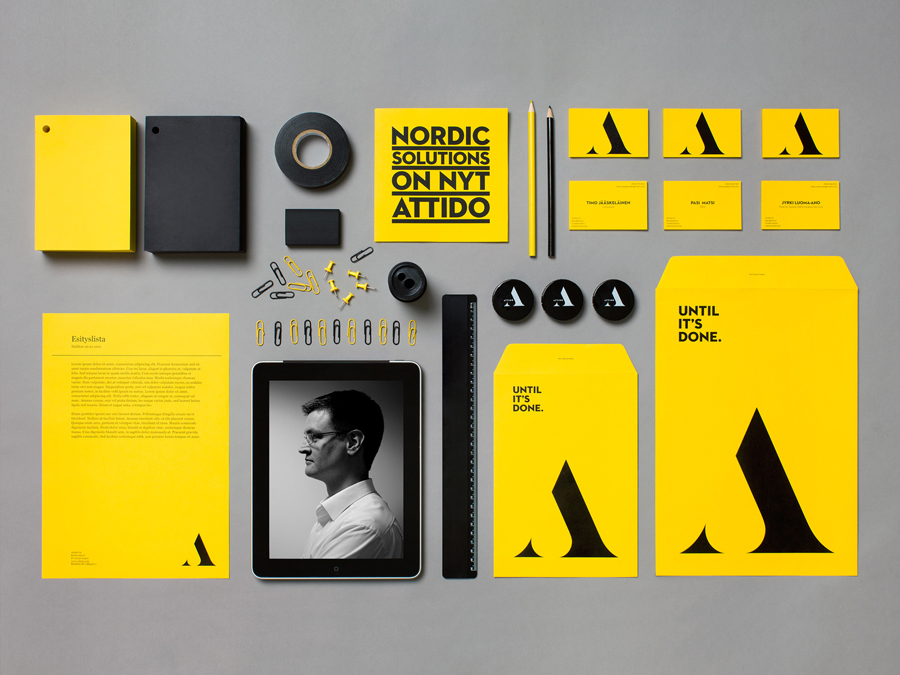 Logo and stationery with a yellow and black colour palette designed by Bond for Finnish information system development and optimisation company Attido