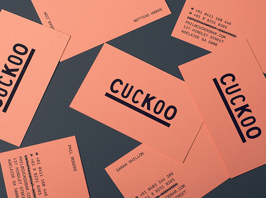 Logo and salmon pink business card designed by Band for underground electronic music venue, cocktail and tapas bar Cuckoo