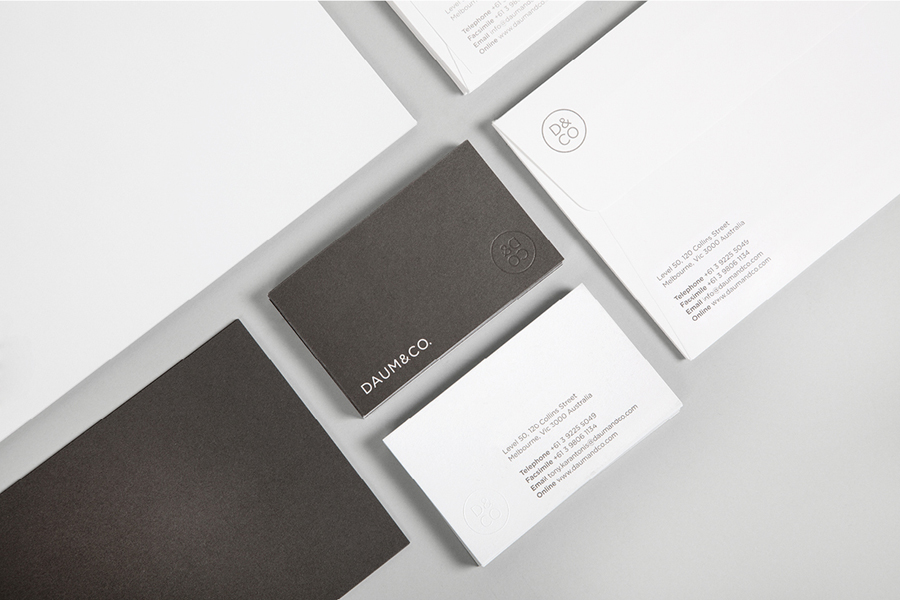 Logo and blind embossed business card designed by Hunt Studio for business advisory and management consultancy Daum & Co