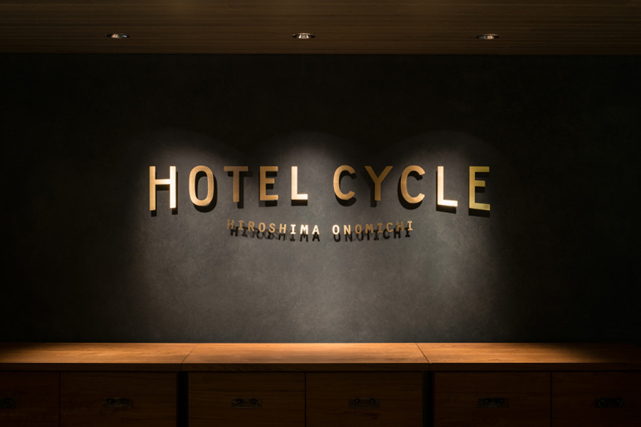 Logotype and interior signage designed by UMA for U2's Onomichi based Hotel Cycle