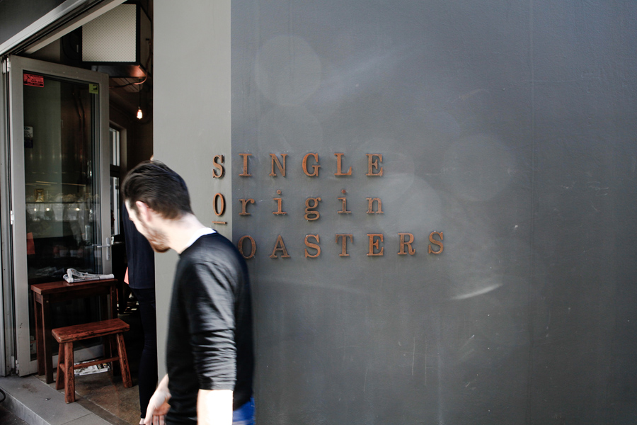 Weathered exterior signage for Single Origin Roasters designed by Maud