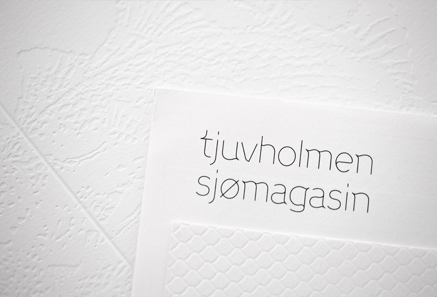 Logo and print with blind debossed illustrative detail designed by Work In Progress for Norwegian seafood restaurant Tjuvholmen Sjømagasin