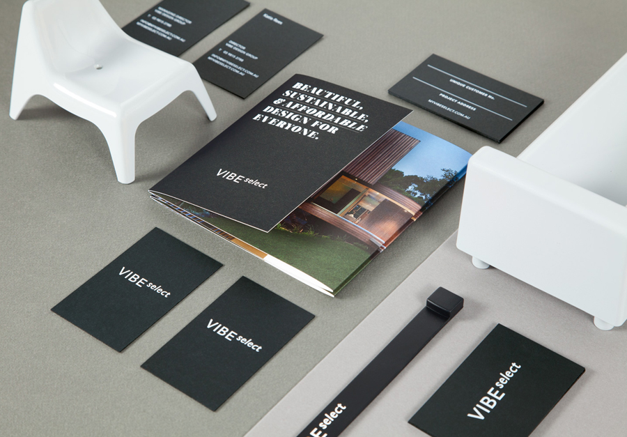 Sans-serif logotype, brochure and white ink and black board business card for architectural firm Vibe Select designed by Studio Constantine