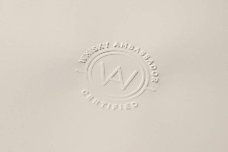 Blind embossed logo designed by O Street for Whisky Ambassador