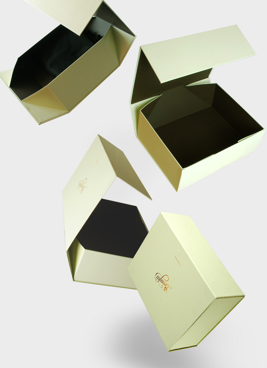 Packaging with gold foil print finish and mint paper designed by Parent for luxury lingerie brand Beaujais