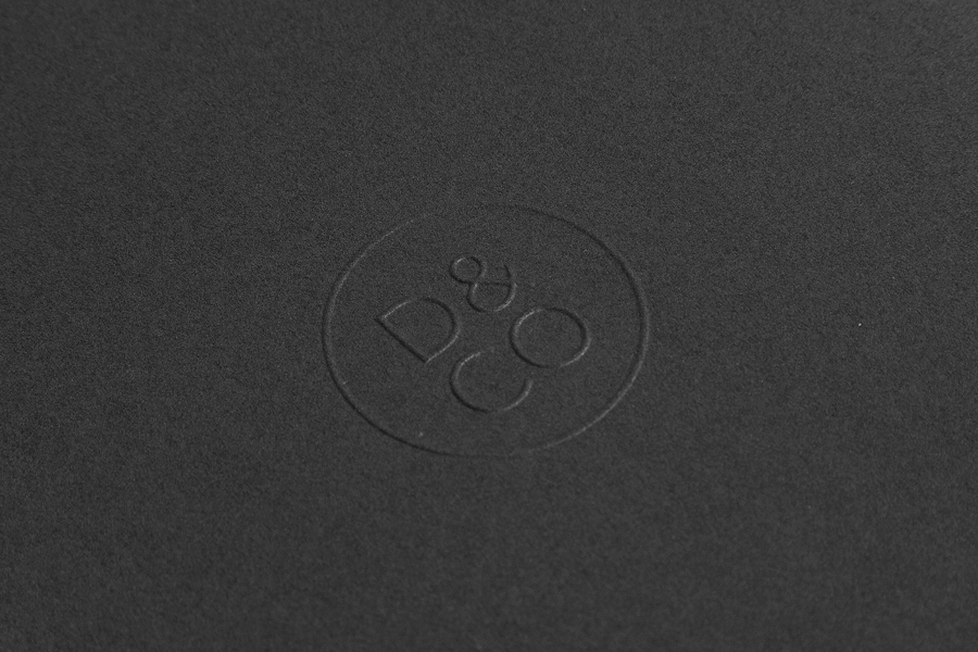 Logo and a blind embossed detail designed by Hunt Studio for business advisory and management consultancy Daum & Co