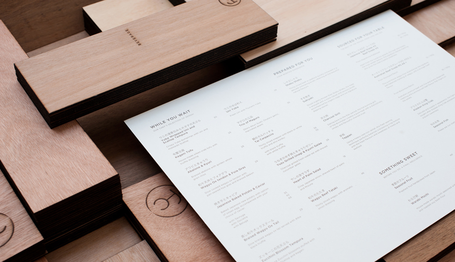 Logo and wooden menu with heat stamp treatment for specialist beef restaurant Fat Cow designed by Foreign Policy