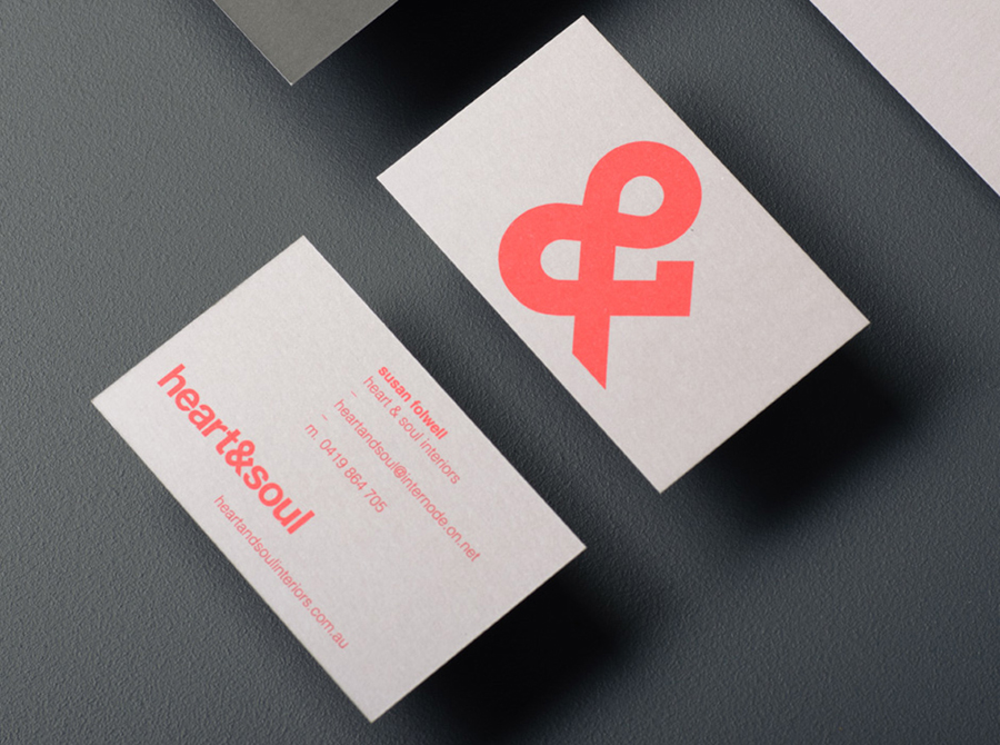 Logo and business card with neon ink and unbleached board detail designed by Band for interior decoration firm Heart & Soul