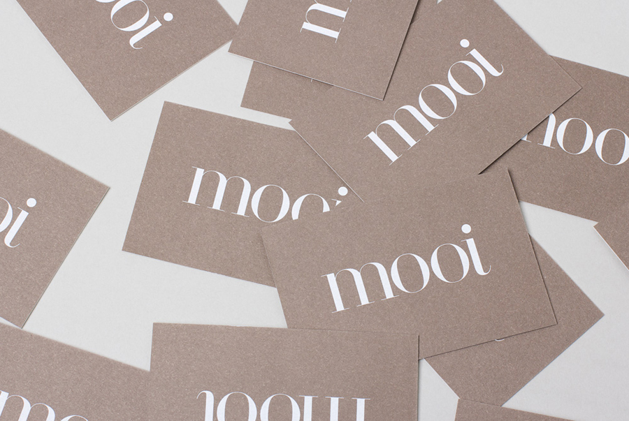 Logo and business card with a white screen printed ink and 100% cotton board designed by Morse Studio for fashion boutique Mooi