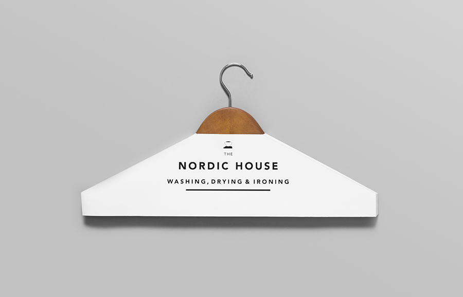 Logotype and clothes hanger cover designed by Anagrama for dry cleaning shop Nordic House