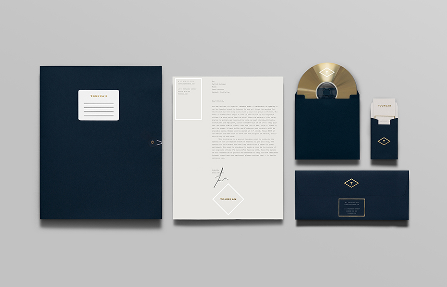 Logo and stationery with blind emboss, silver and gold foil detail designed for British multinational venture capital firm Tourean by Anagrama 