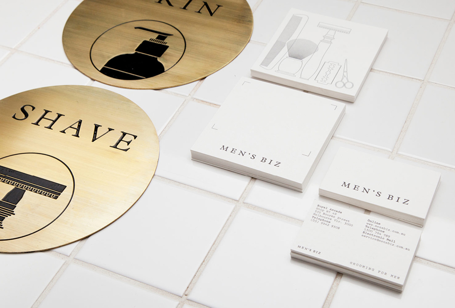 Logotype, letterpress business cards and acid-etched brass signage by ThoughtAssembly for male grooming business Men's Biz