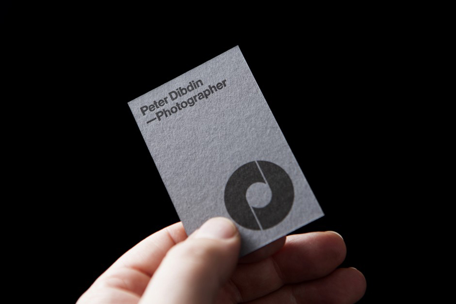 Monogram, logotype and grey board business card designed by O Street for photographer Peter Dibdin