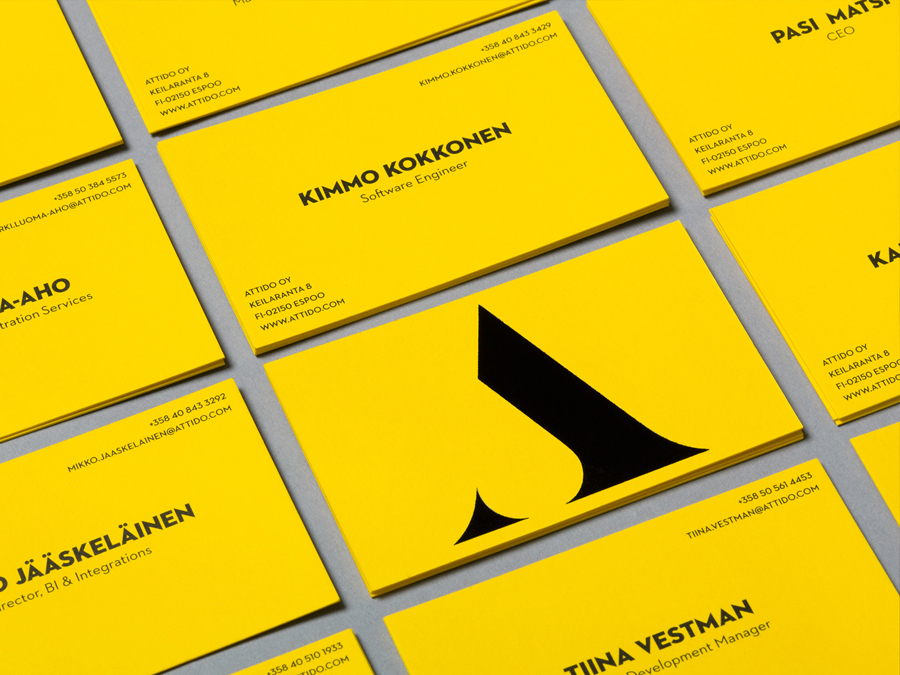 Logo and business card with a yellow board and black ink colour palette designed by Bond for Finnish information system development and optimisation company Attido