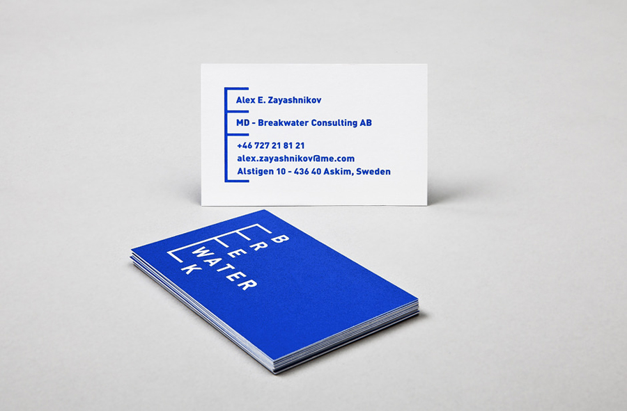 Logo and business card with bright blue spot ink treatment for Swedish marine cargo logistics company Breakwater designed by Lundgren+Lindqvist