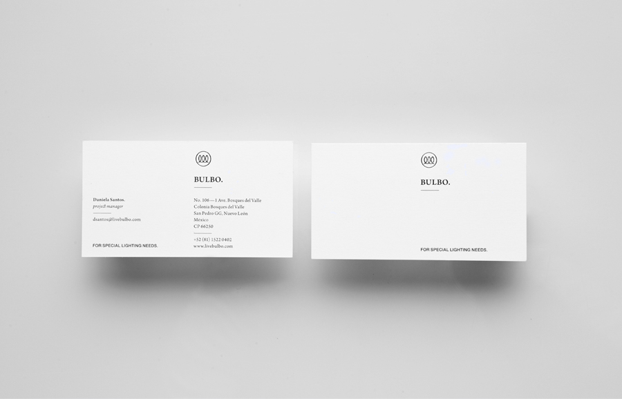 Logo and business card with silver foil detail for high-end boutique lighting shop and interior planning service Bulbo designed by Anagrama