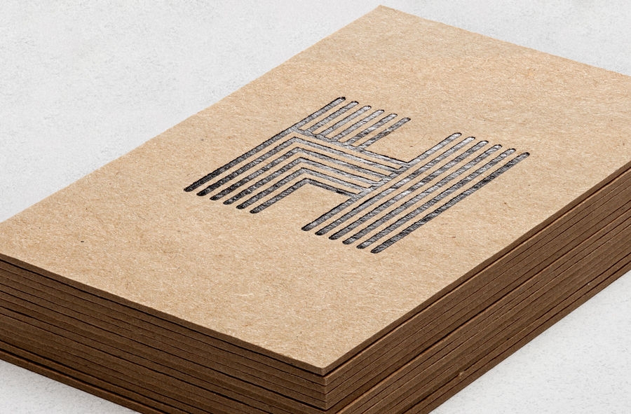 Logo as a black foil detail across an unbleached business cards design by Spy for architecture firm Haverstock