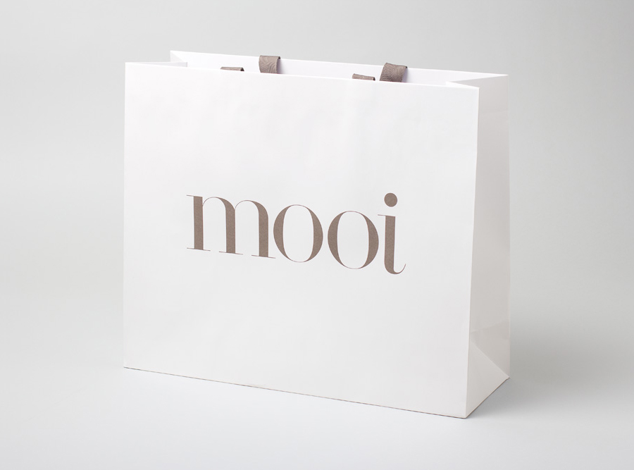 Logo and paper shopping bag designed by Morse Studio for fashion boutique Mooi