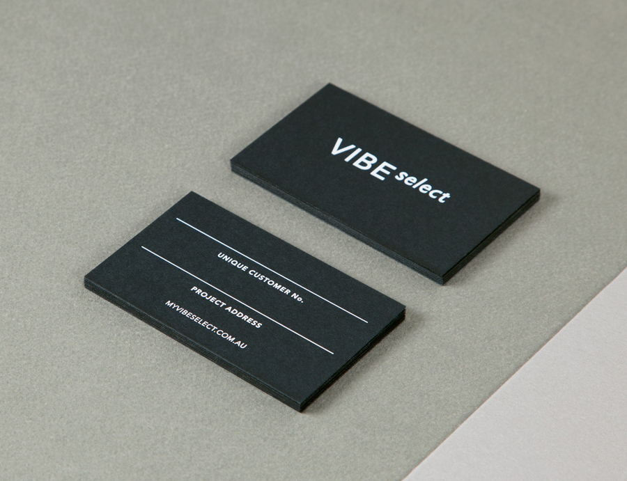 Sans-serif logotype and black board business card with white screen-printed detail for architectural firm Vibe Select designed by Studio Constantine.