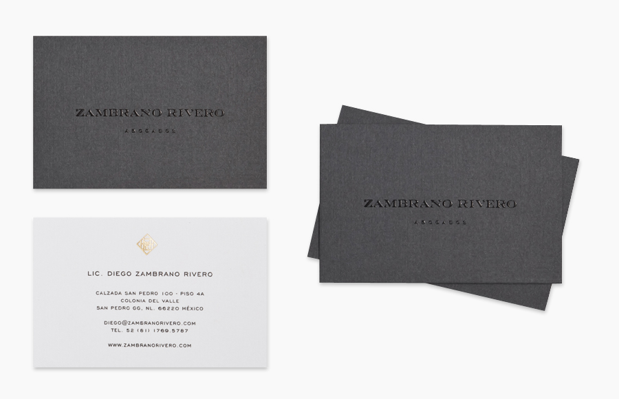 Logo and textile business card with thermographic ink and gold foil print finish designed by Face for San Pedro law firm Zambrano Rivero