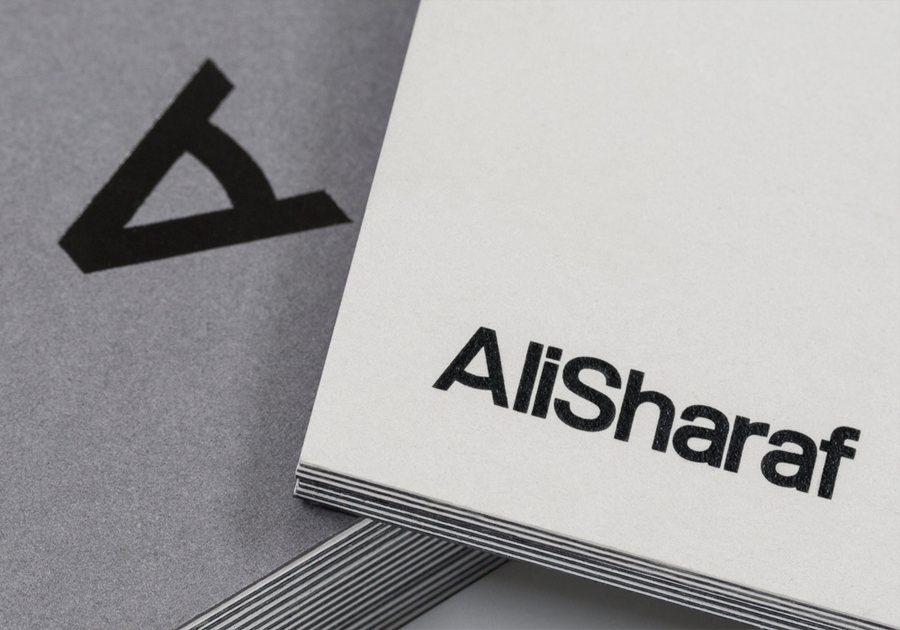 Logo and duplex business card with black foil detail designed by Mash for photographer Ali Sharaf