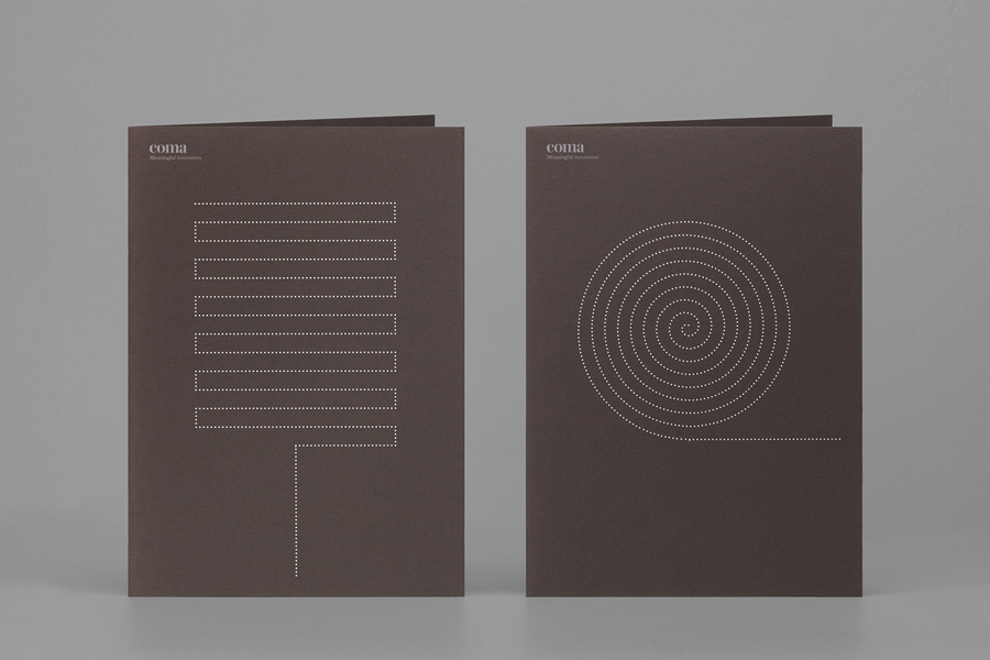 Folder with brown card and silver foil detail designed by Mucho for Spanish leadership consultancy Coma